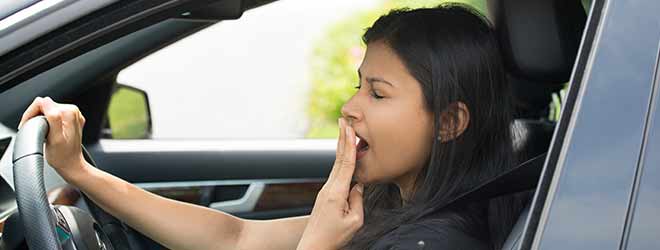 Woman with a sleep disorder yawning