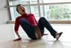 A man screaming for a rhode island personal injury lawyer after a slip and fall injury.