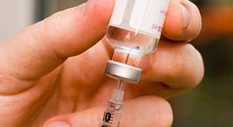 A syringe being filled up.