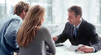 Two clients talking to a personal injury lawyer with regards to a Transvaginal Mesh Lawsuit