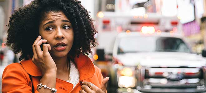Woman calling police after a pedestrian accident