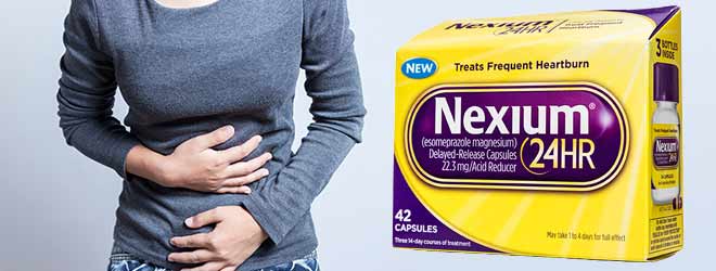 A box of Nexium next to a woman holding her stomach in pain. 