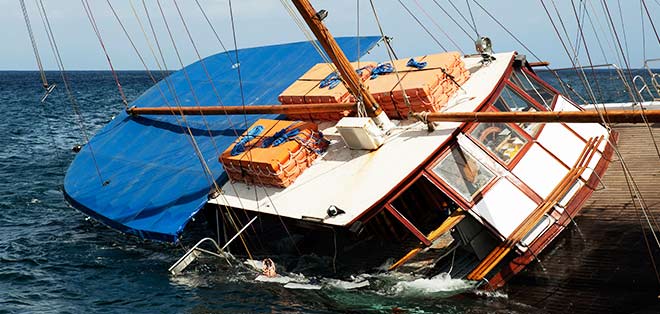 Boat sinking after accident at sea