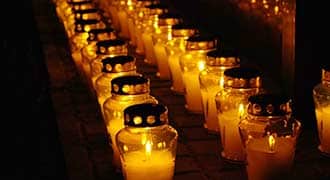 candles lit in a row after a wrongful death