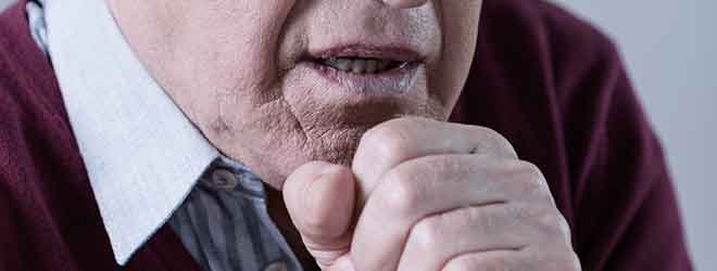 Man coughing from carbon monoxide poisoning