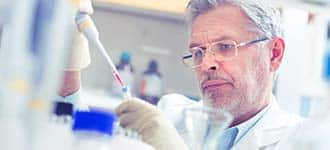 A scientist working in a lab. 