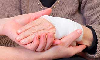 An injured wrist wrapped in bandages. 