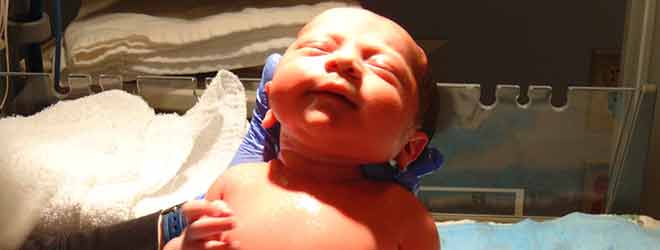 A newborn infant. 