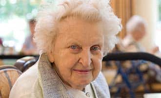 An elderly woman in a nursing home. 