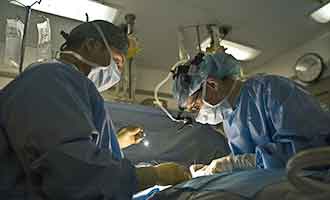 Doctors performing surgery on a Rhode Island Burn Injury Victim.