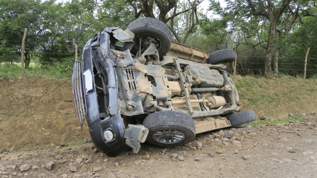 Car flipped on its side.