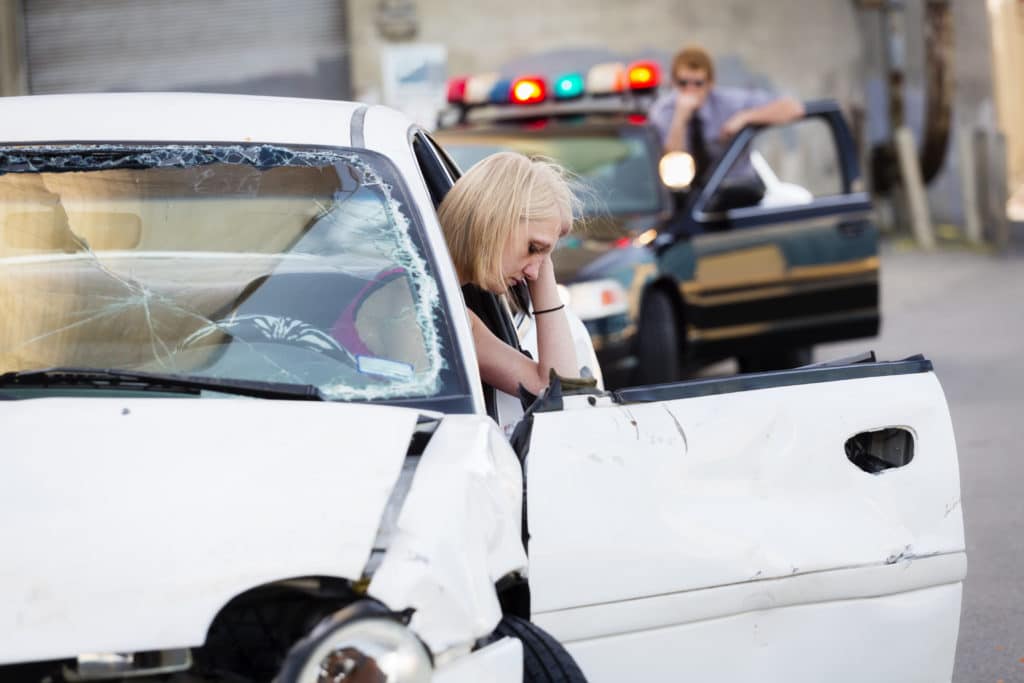Woman hurt after car accident with police on the scene
