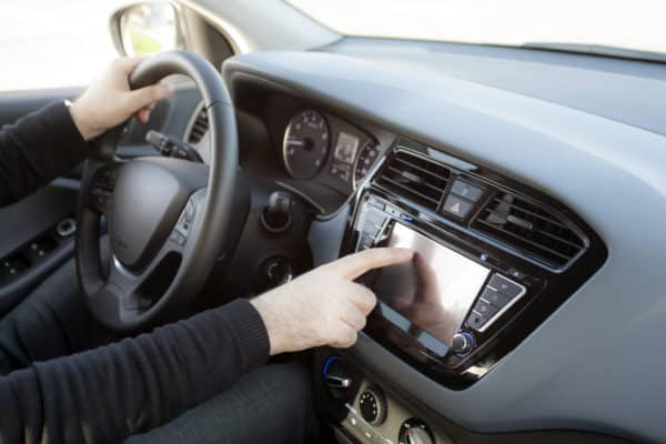 driver using car navigation system