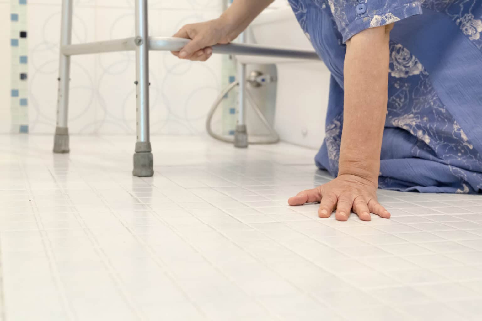 Nursing home resident on ground with walker