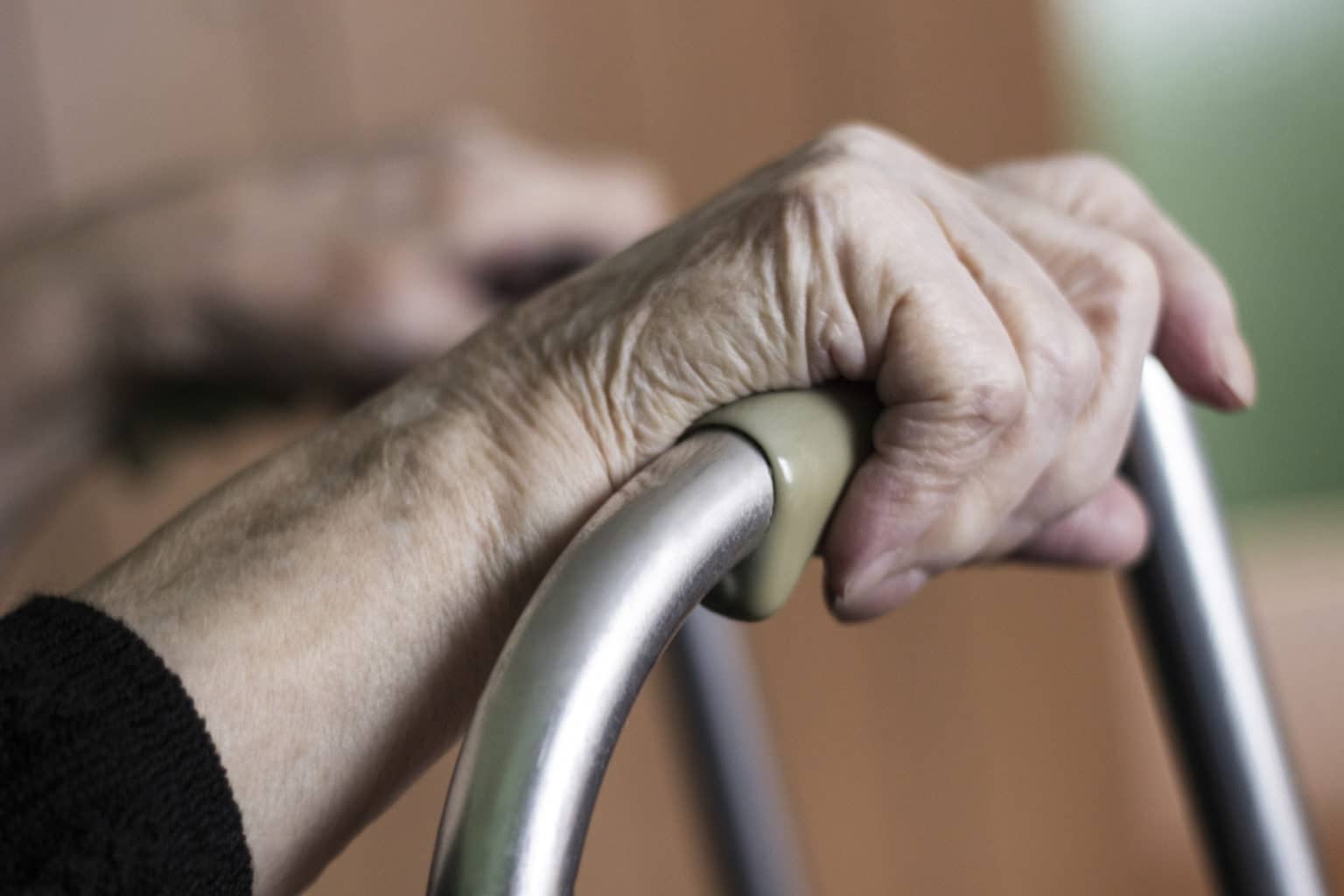 Nursing home woman using walker