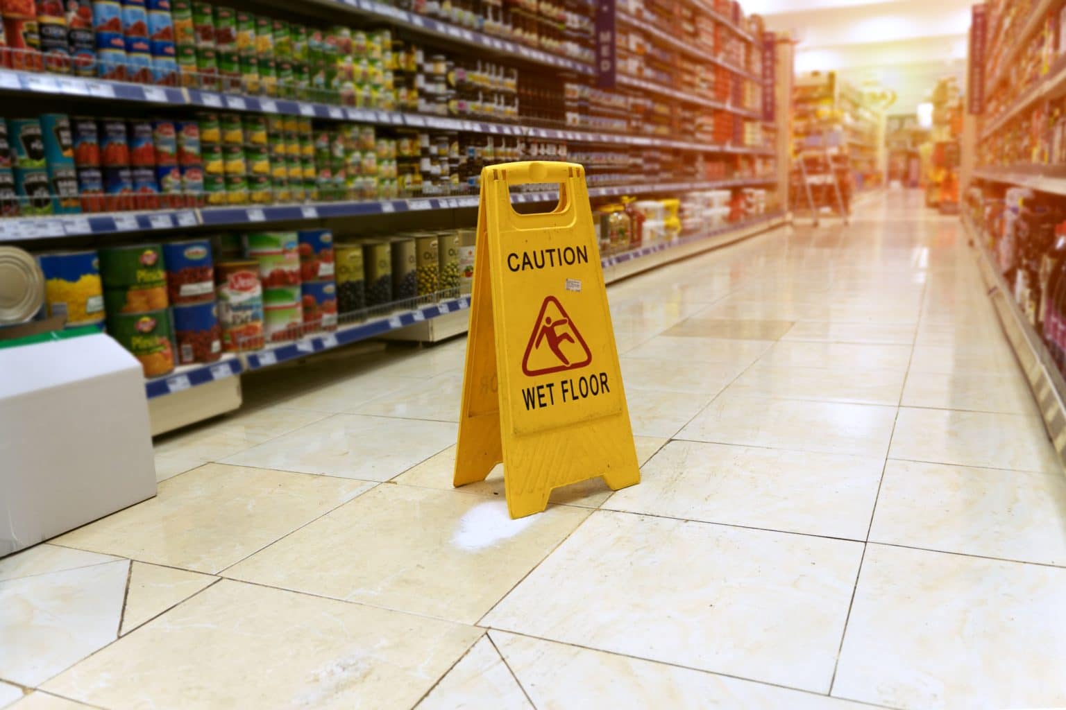 Caution wet floor sign at supermarket