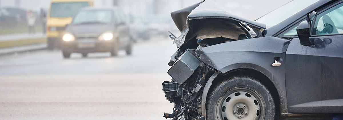 Damaged car after accident on highway