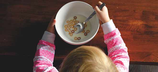 child eating bowl of cereal