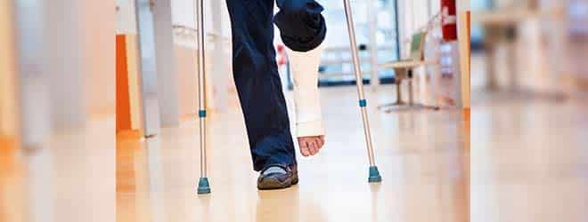 Man with broken leg on crutches