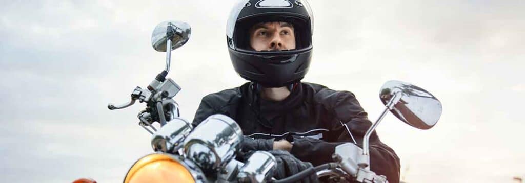 Motorcycle rider wearing a helmet