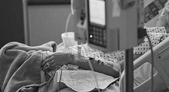 woman hooked up to machines in the hospital