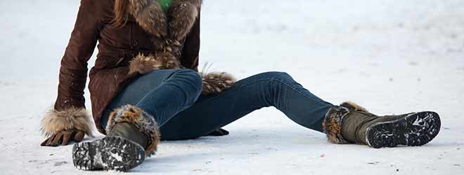 woman slipping and falling on ice