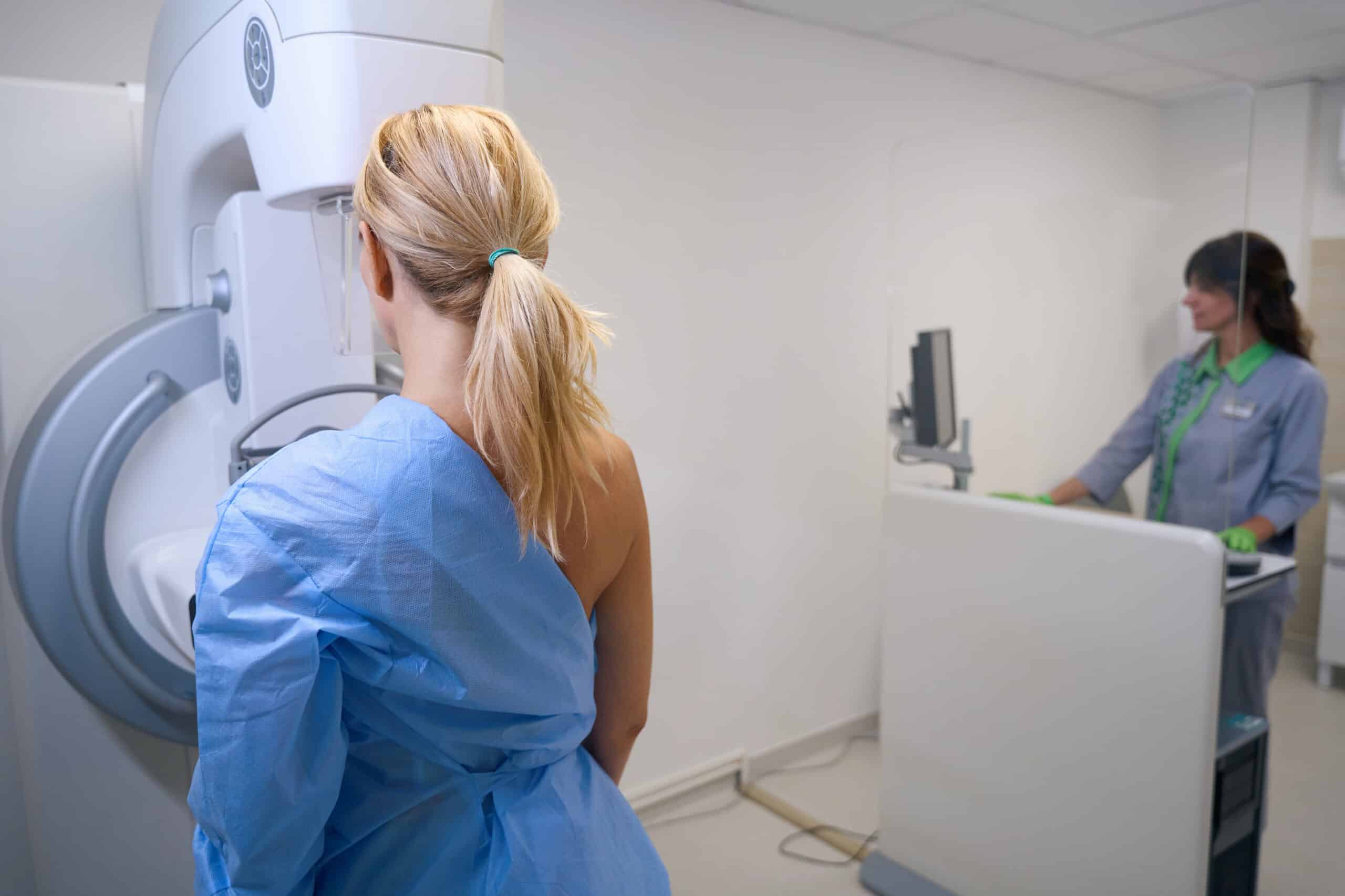 A woman undergoing a mammogram screening.
