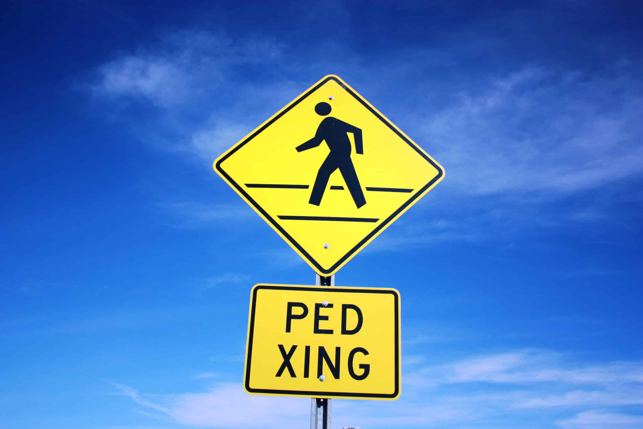 A pedestrian crossing sign